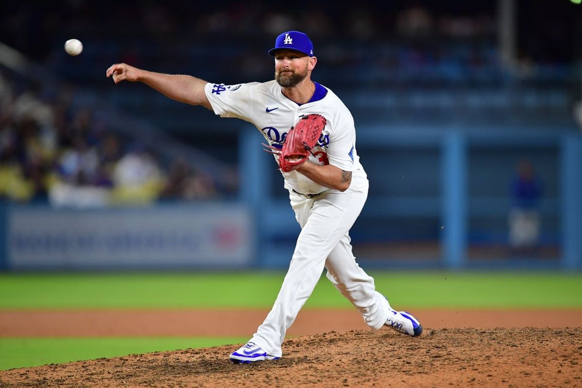 Jul 21, 2025; Los Angeles, California, USA; Los Angeles Dodgers pitcher Kirby Yates (38) throws against the Minnesota Twins during the ninth inning at Dodger Stadium. Mandatory Credit: Gary A. Vasquez-Imagn Images