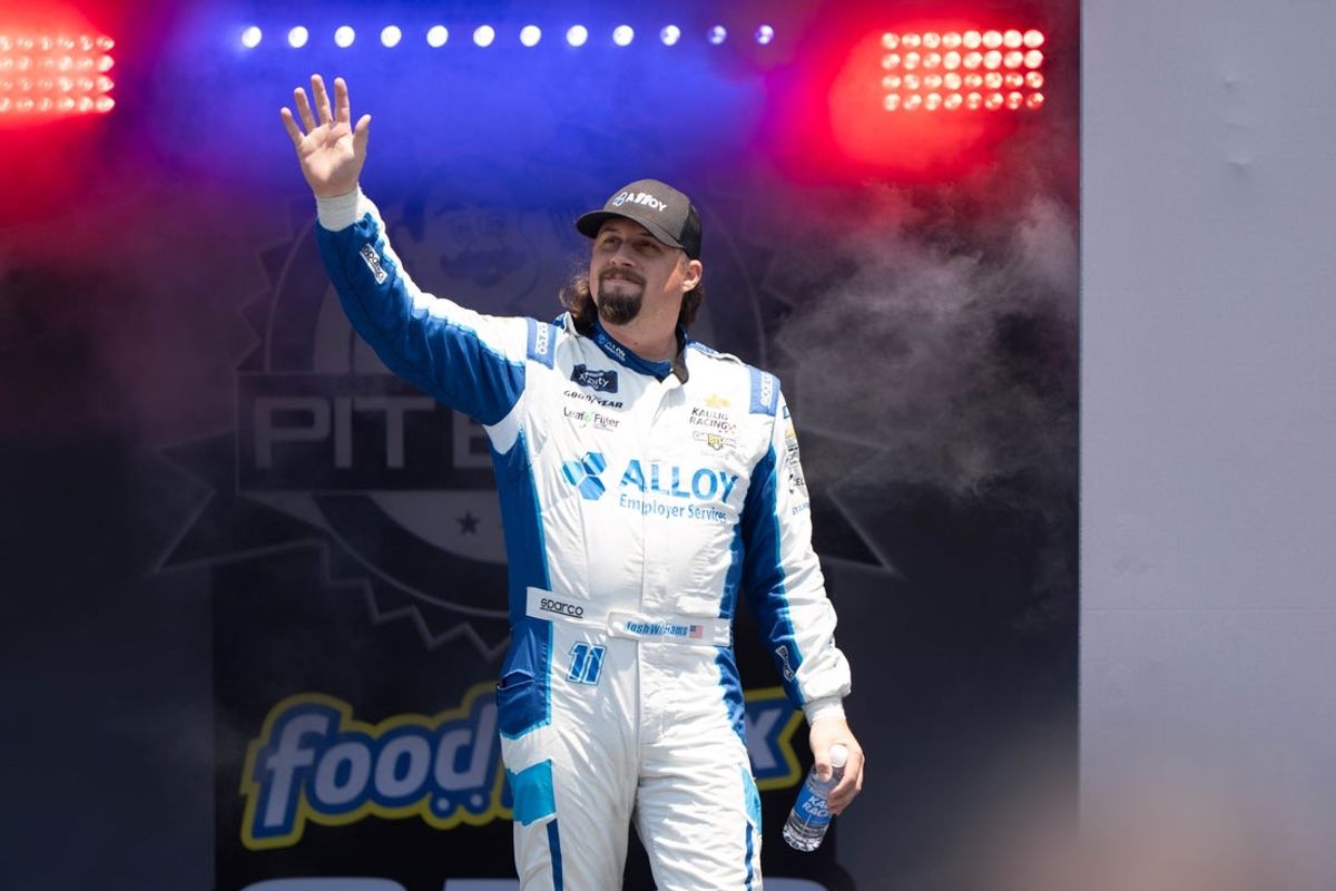 Jul 12, 2025; Sonoma, California, USA;  NASCAR Xfinity Series driver Josh Williams (11) waves after being introduced to fans before the start of the NASCAR Xfinity Series Race at Sonoma Raceway. Mandatory Credit: Stan Szeto-Imagn Images