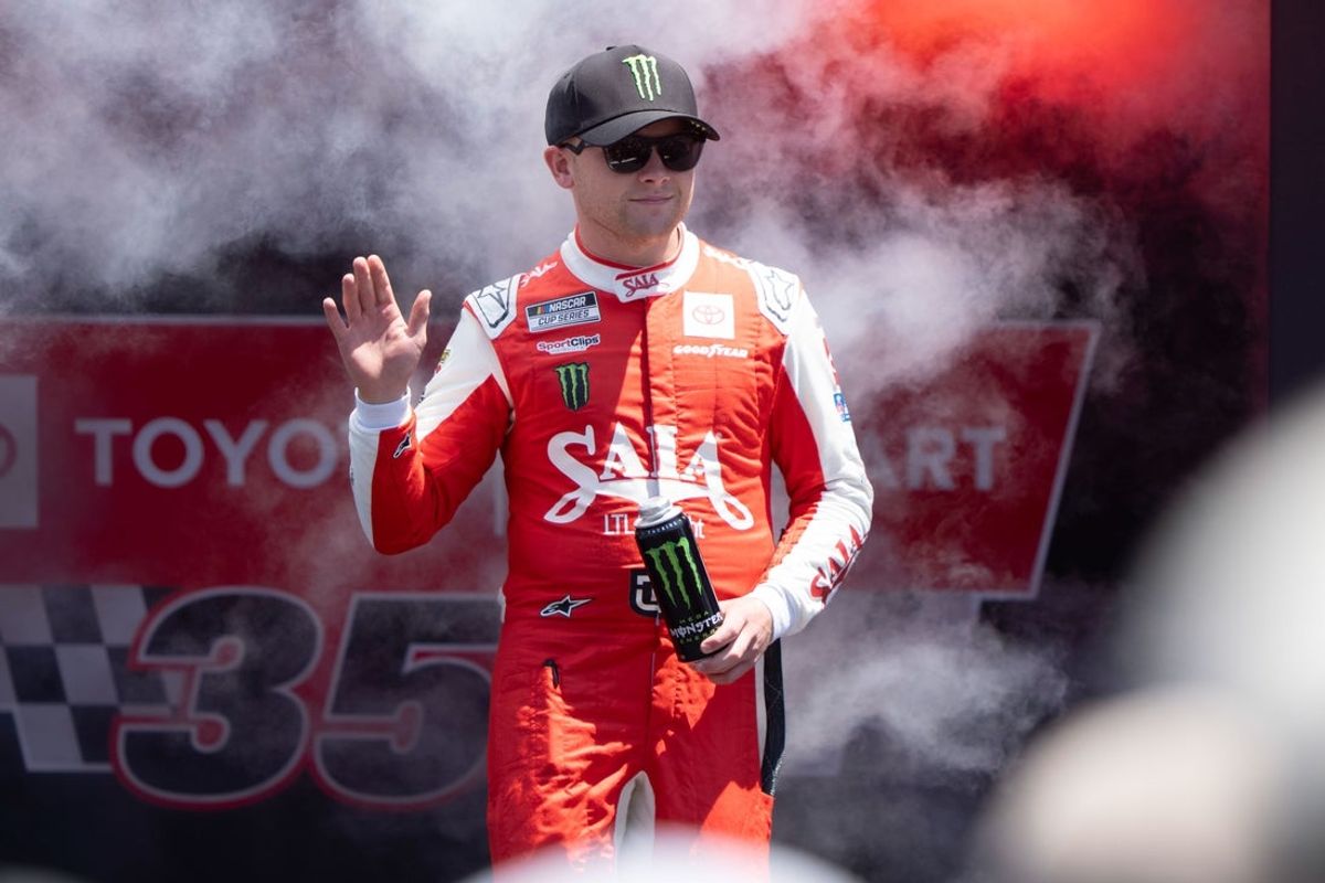 Jul 13, 2025; Sonoma, California, USA;  NASCAR Cup Series driver Ty Gibbs (54) waves after being introduced to fans before the start of the NASCAR Toyota / Save Mart 360 at Sonoma Raceway. Mandatory Credit: Stan Szeto-Imagn Images