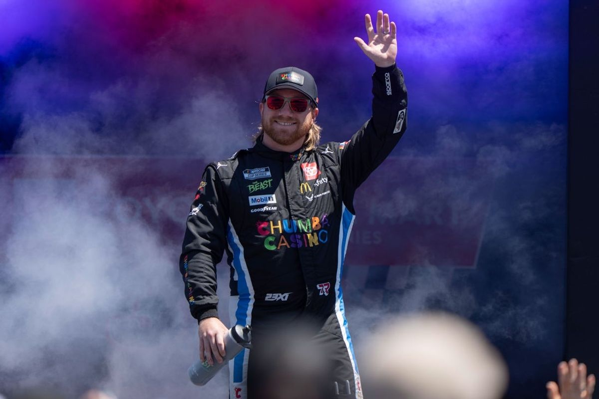 Jul 13, 2025; Sonoma, California, USA;  NASCAR Cup Series driver Tyler Reddick (45) waves after being introduced to fans before the start of the NASCAR Toyota / Save Mart 360 at Sonoma Raceway. Mandatory Credit: Stan Szeto-Imagn Images