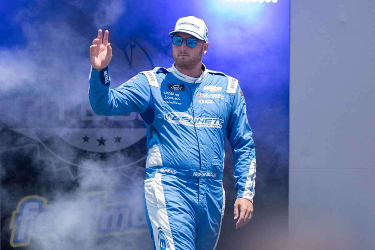 Jul 12, 2025; Sonoma, California, USA;  NASCAR Xfinity Series driver Austin Hill (21) waves after being introduced to fans before the start of the NASCAR Xfinity Series Race at Sonoma Raceway. Mandatory Credit: Stan Szeto-Imagn Images