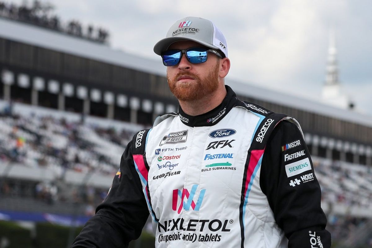 Jun 21, 2025; Long Pond, Pennsylvania, USA; NASCAR Cup Series driver Chris Buescher walks on pit road during practice and qualifying for The Great American Getaway 400 at Pocono Raceway. Mandatory Credit: Matthew O'Haren-Imagn Images