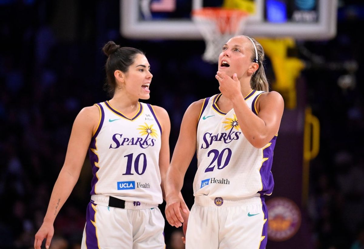 Jul 13, 2025; Los Angeles, California, USA; Los Angeles Sparks guard Kelsey Plum (10) and Los Angeles Sparks guard Julie Allemand (20) during the fourth quarter against the Connecticut Sun at Crypto.com Arena. Mandatory Credit: Robert Hanashiro-Imagn Images