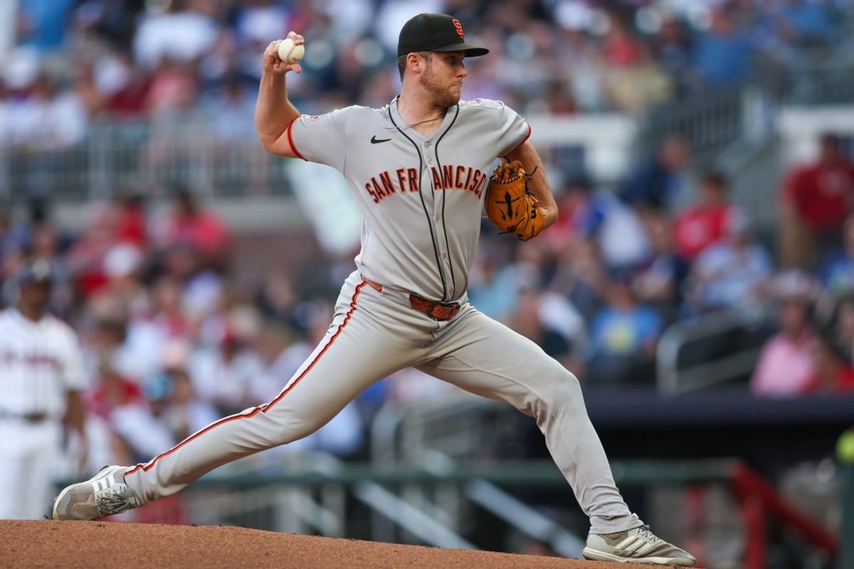 Jul 22, 2025; Atlanta, Georgia, USA; San Francisco Giants starting pitcher Landen Roupp (65) throws against the Atlanta Braves in the second inning at Truist Park. Mandatory Credit: Brett Davis-Imagn Images