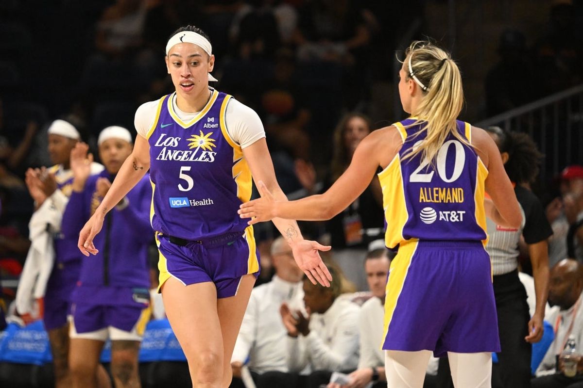 Jul 22, 2025; Washington, District of Columbia, USA;  Los Angeles Sparks forward Dearica Hamby (5) celebrates a basket with guard Julie Allemand (20) against the Washington Mystics during the fourth quarter at CareFirst Arena. Mandatory Credit: Rafael Suanes-Imagn Images