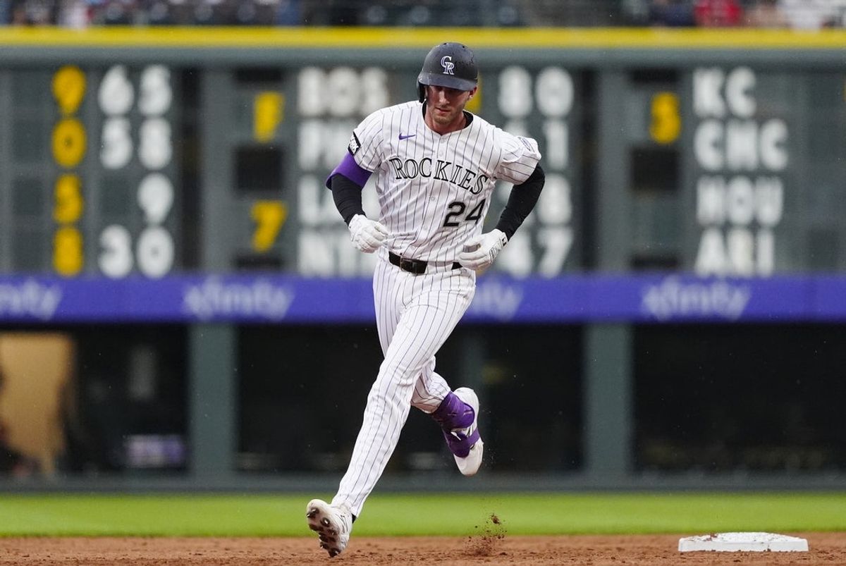 Jul 22, 2025; Denver, Colorado, USA;Colorado Rockies third baseman Ryan McMahon (24) runs off a three run home run in the fourth inning against the St. Louis Cardinals at Coors Field. Mandatory Credit: Ron Chenoy-Imagn Images