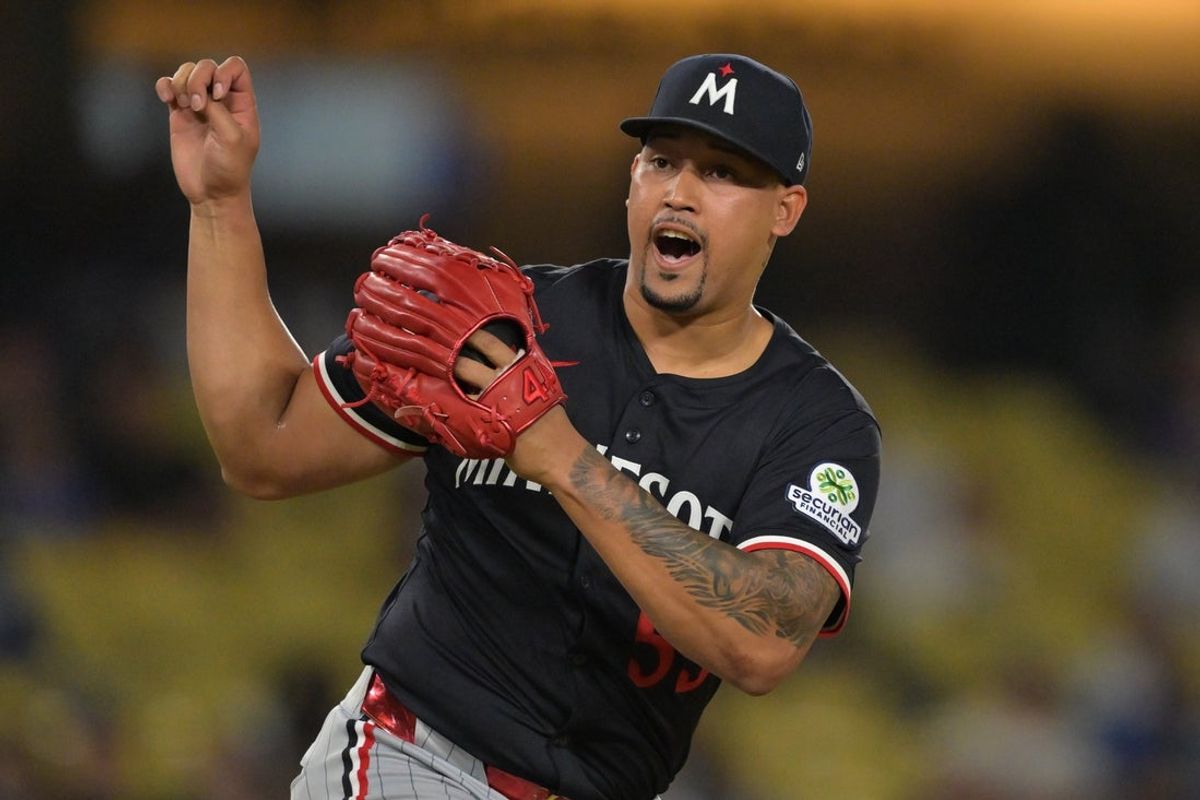 Jul 22, 2025; Los Angeles, California, USA;  Minnesota Twins relief pitcher Jhoan Duran (59) reacts after the final out of the ninth inning against the Los Angeles Dodgers at Dodger Stadium. Mandatory Credit: Jayne Kamin-Oncea-Imagn Images