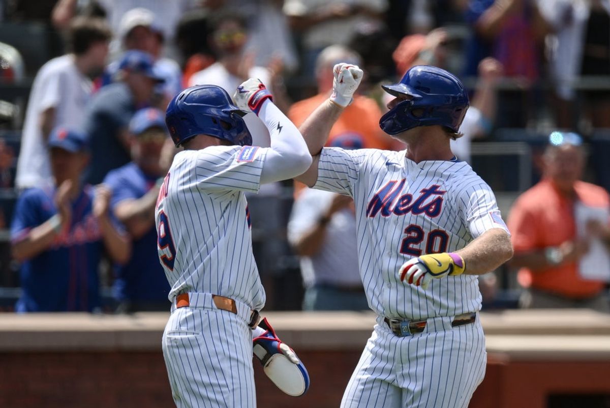 Jul 23, 2025; New York City, New York, USA; New York Mets first baseman Pete Alonso (20) is greeted at home plate by outfielder Brandon Nimmo (9) after hitting a three run home run against the Los Angeles Angels during the third inning at Citi Field. Mandatory Credit: John Jones-Imagn Images