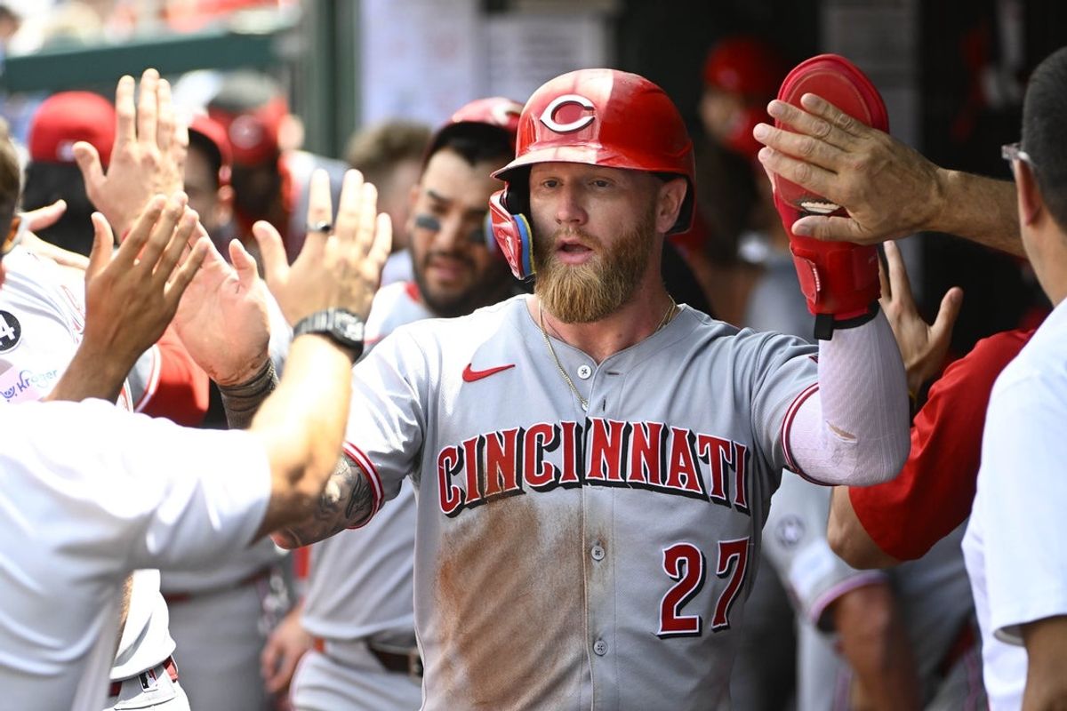 Jul 23, 2025; Washington, District of Columbia, USA; Cincinnati Reds right fielder Jake Fraley (27) is congratulated by teammates after scoring a run during the eighth inning against the Washington Nationals at Nationals Park. Mandatory Credit: Brad Mills-Imagn Images