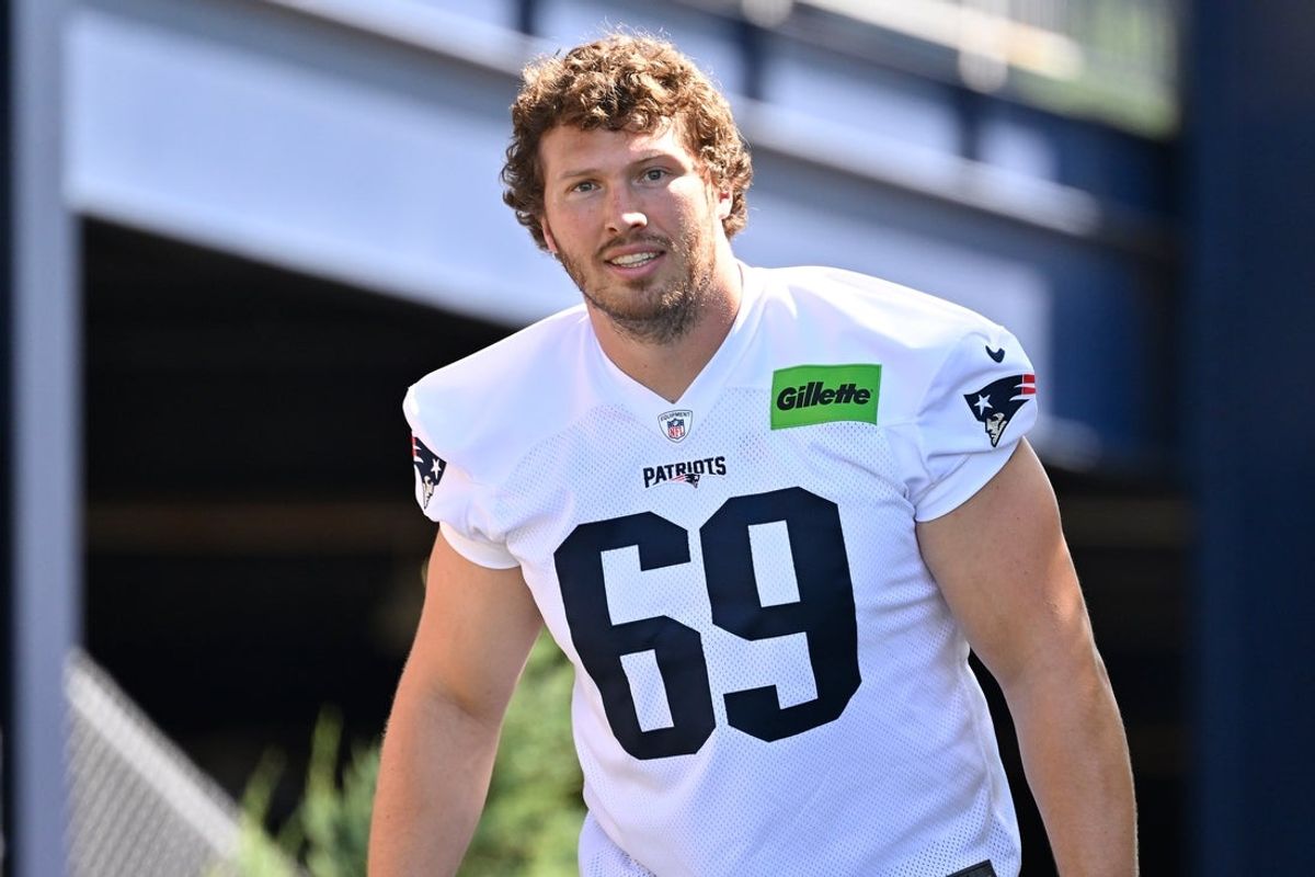 Jul 23, 2025; Foxborough, MA, USA; New England Patriots guard Cole Strange (69) walks to the practice field for training camp at Gillette Stadium. Mandatory Credit: Eric Canha-Imagn Images
