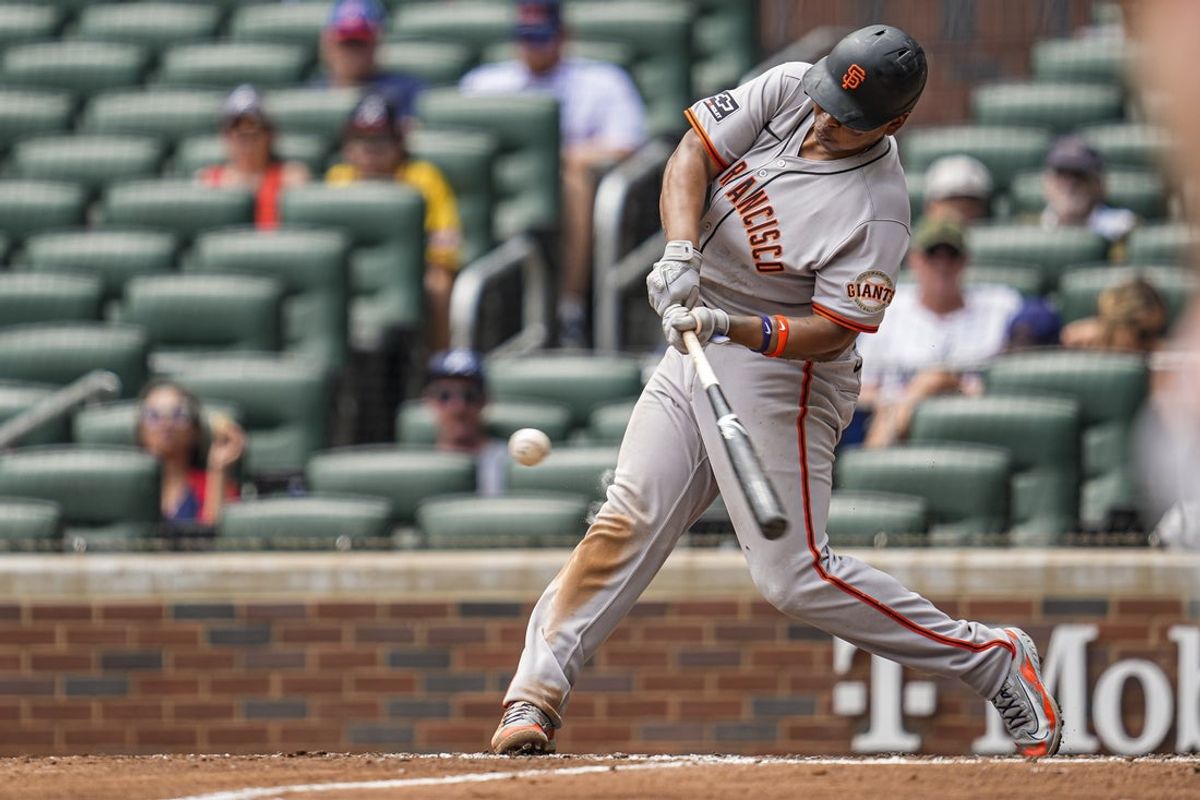 Jul 23, 2025; Cumberland, Georgia, USA; San Francisco Giants designated hitter Rafael Devers (16) hits a three run home run against the Atlanta Braves during the sixth inning at Truist Park. Mandatory Credit: Dale Zanine-Imagn Images