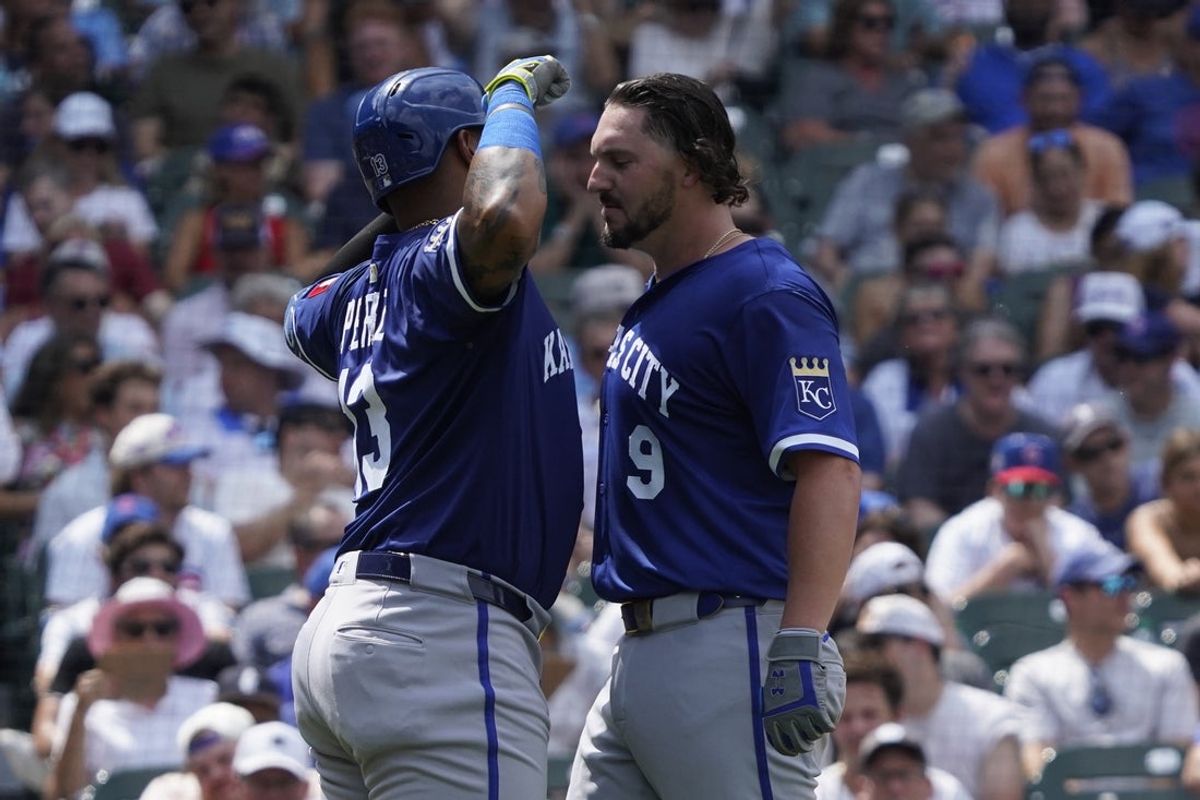 Jul 23, 2025; Chicago, Illinois, USA; Kansas City Royals first base Vinnie Pasquantino (9) is greeted by designated hitter Salvador Perez (13) after hitting a two-run home run against the Chicago Cubs during the fifth inning at Wrigley Field. Mandatory Credit: David Banks-Imagn Images