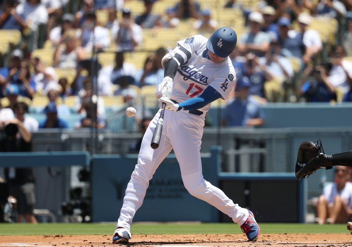 Jul 23, 2025; Los Angeles, California, USA; Los Angeles Dodgers designated hitter Shohei Ohtani (17) hits a home run during the first inning against the Minnesota Twins at Dodger Stadium. Mandatory Credit: Kiyoshi Mio-Imagn Images