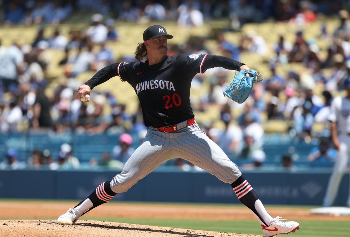 Jul 23, 2025; Los Angeles, California, USA; Minnesota Twins starting pitcher Chris Paddack (20) throws during the second inning against the Los Angeles Dodgers at Dodger Stadium. Mandatory Credit: Kiyoshi Mio-Imagn Images