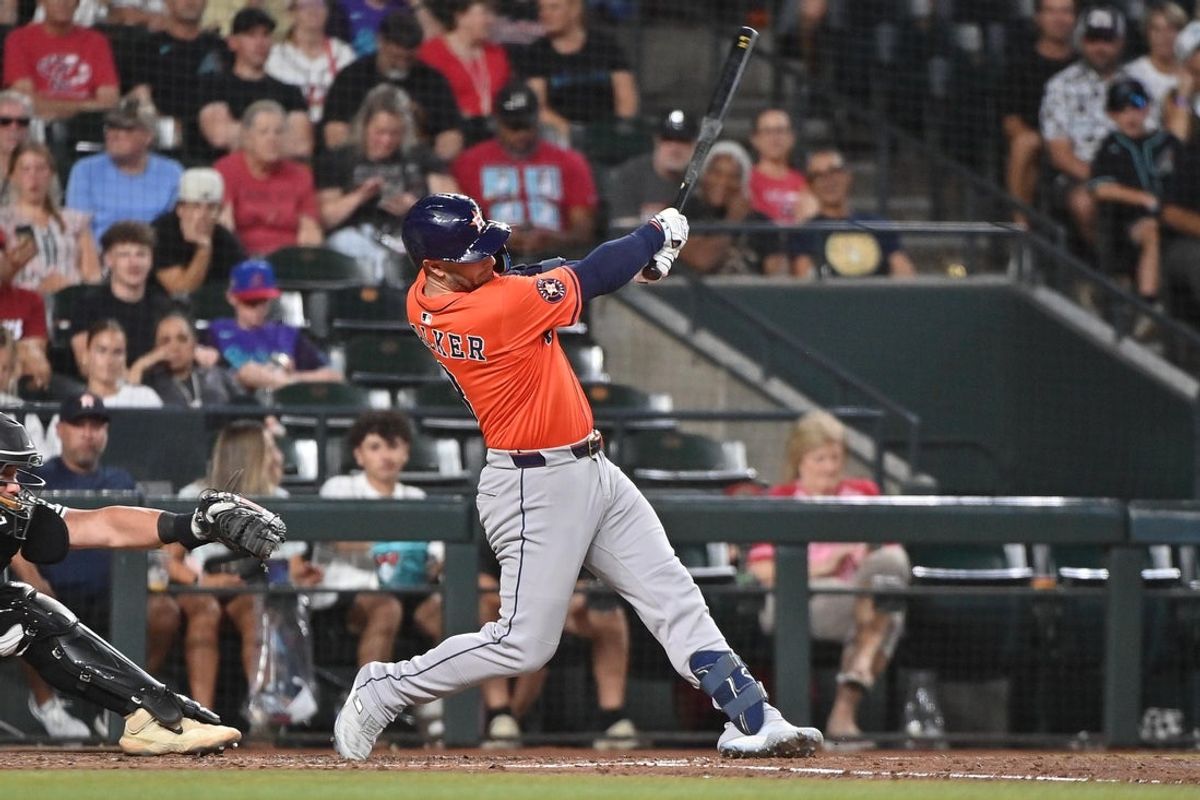 Jul 23, 2025; Phoenix, Arizona, USA;  Houston Astros first base Christian Walker (8) doubles in the sixth inning against the Arizona Diamondbacks at Chase Field. Mandatory Credit: Matt Kartozian-Imagn Images