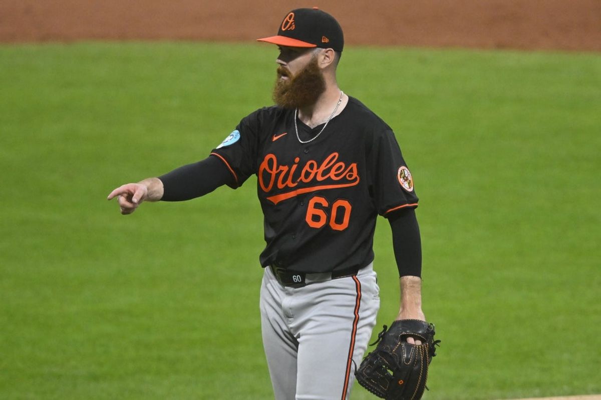 Jul 23, 2025; Cleveland, Ohio, USA; Baltimore Orioles relief pitcher Colin Selby (60) reacts in the eighth inning against the Cleveland Guardians at Progressive Field. Mandatory Credit: David Richard-Imagn Images