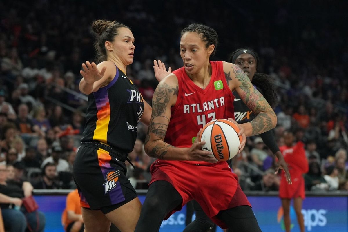 Jul 23, 2025; Phoenix, Arizona, USA; Atlanta Dream center Brittney Griner (42) drives on Phoenix Mercury forward Kathryn Westbeld (24) in the first half at Footprint Center. Mandatory Credit: Rick Scuteri-Imagn Images