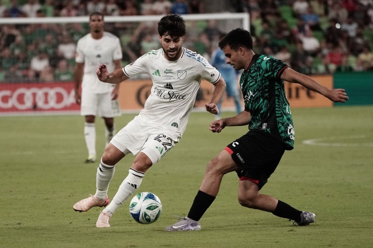 Jul 23, 2025; Austin, Texas, USA; MLS All Stars midfielder Carles Gil (22) of New England Revolution  kicks the ball in the second half during the 2025 MLS All-Star Game at Q2 Stadium. Mandatory Credit: Dustin Safranek-Imagn Images