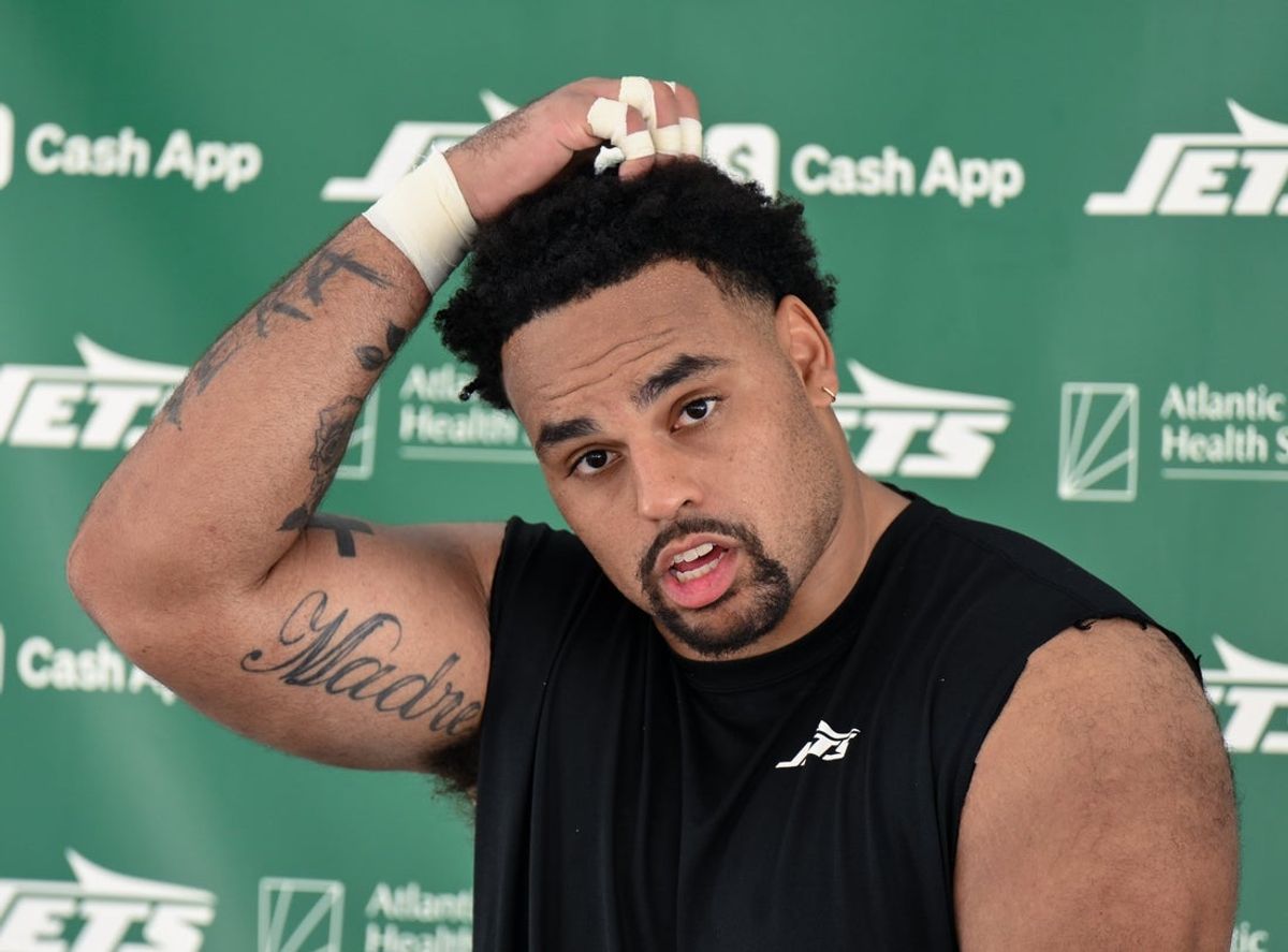 Jul 24, 2025; Florham Park, NY, USA; New York Jets guard Alijah Vera-Tucker (75) speaks to the media during training camp at Atlantic Health Jets Training Center. Mandatory Credit: John Jones-Imagn Images