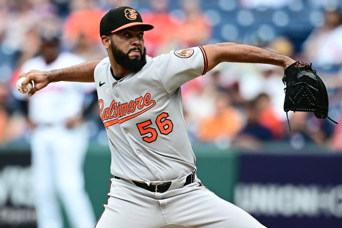 Jul 24, 2025; Cleveland, Ohio, USA; Baltimore Orioles relief pitcher Seranthony Dominguez (56) throws a pitch during the eighth inning against the Cleveland Guardians at Progressive Field. Mandatory Credit: Ken Blaze-Imagn Images