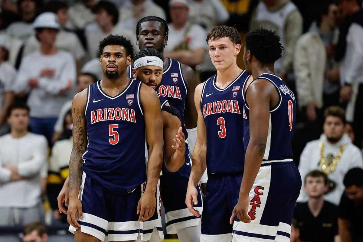 Feb 10, 2024; Boulder, Colorado, USA; Arizona Wildcats guard KJ Lewis (5) and guard Kylan Boswell (4) and center Oumar Ballo (11) and guard Pelle Larsson (3) and guard Jaden Bradley (0) in the first half against the Colorado Buffaloes at CU Events Center.