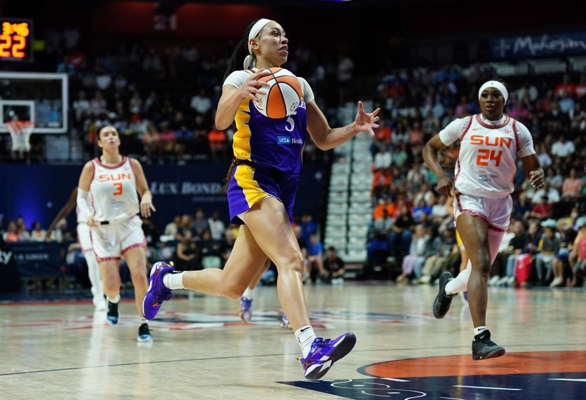 Jul 24, 2025; Uncasville, Connecticut, USA; Los Angeles Sparks forward Dearica Hamby (5) drives the ball against the Connecticut Sun in the first half at Mohegan Sun Arena. Mandatory Credit: David Butler II-Imagn Images