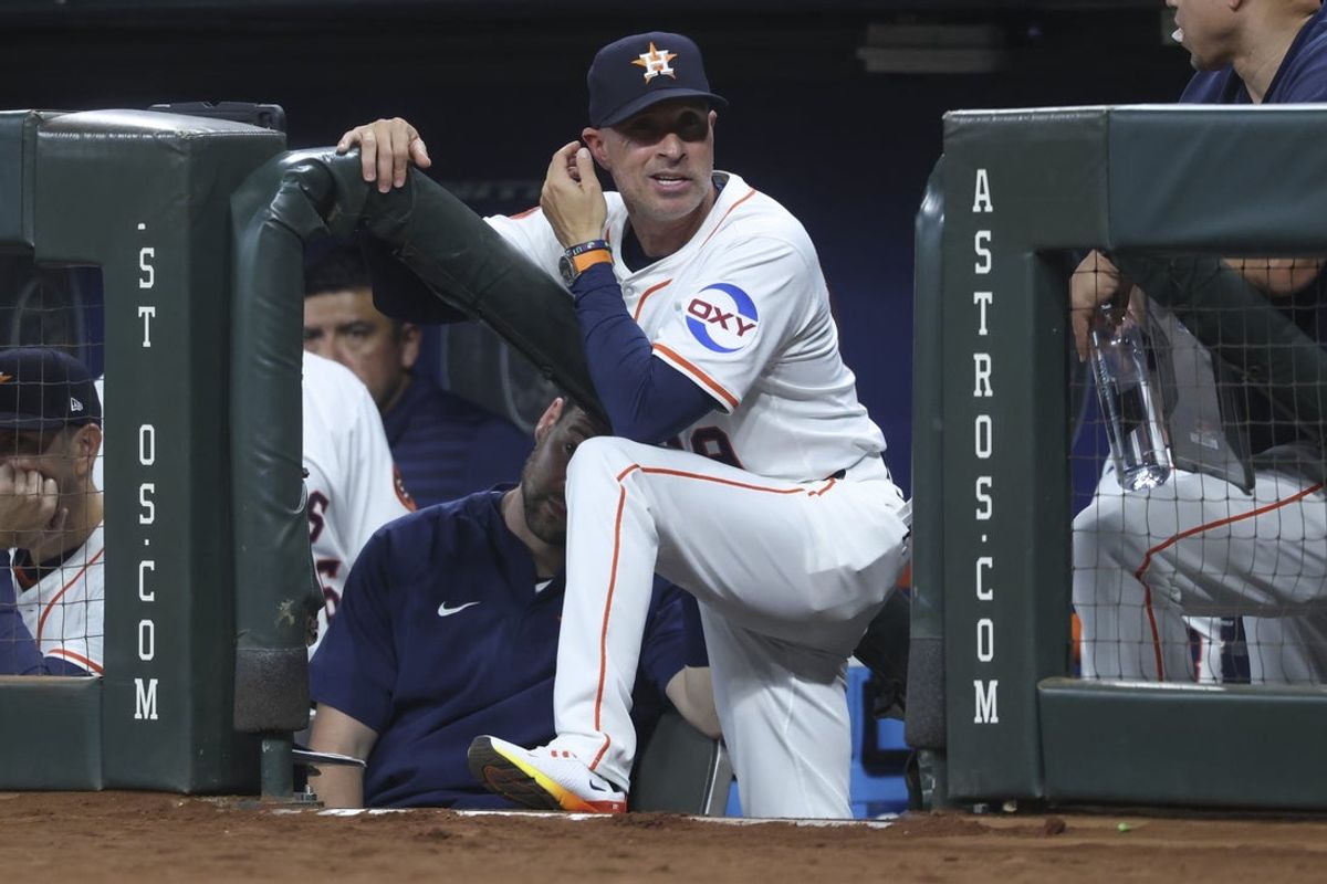 Jul 24, 2025; Houston, Texas, USA;  Houston Astros manager Joe Espada (19) reacts from the dugout steps during the second inning against the Athletics at Daikin Park. Mandatory Credit: Troy Taormina-Imagn Images
