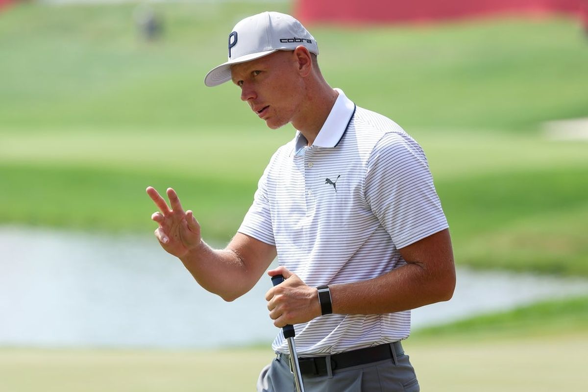 Jul 25, 2025; Blaine, Minnesota, USA; Matti Schmid gestures towards fans after his putt on the 18th green during the second round of the 3M Open golf tournament. Mandatory Credit: Matt Krohn-Imagn Images