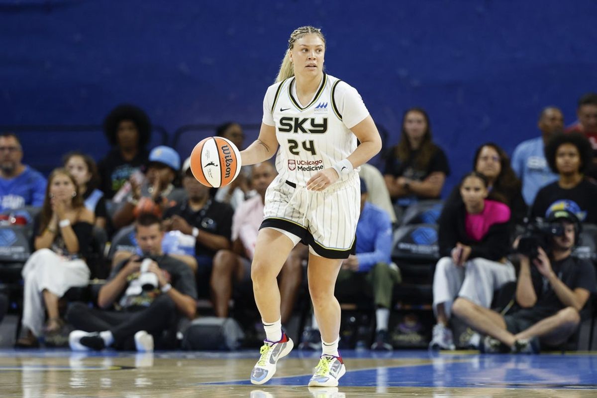 Jul 24, 2025; Chicago, Illinois, USA; Chicago Sky guard Rachel Banham (24) brings the ball up court against the Seattle Storm during the first half at Wintrust Arena. Mandatory Credit: Kamil Krzaczynski-Imagn Images