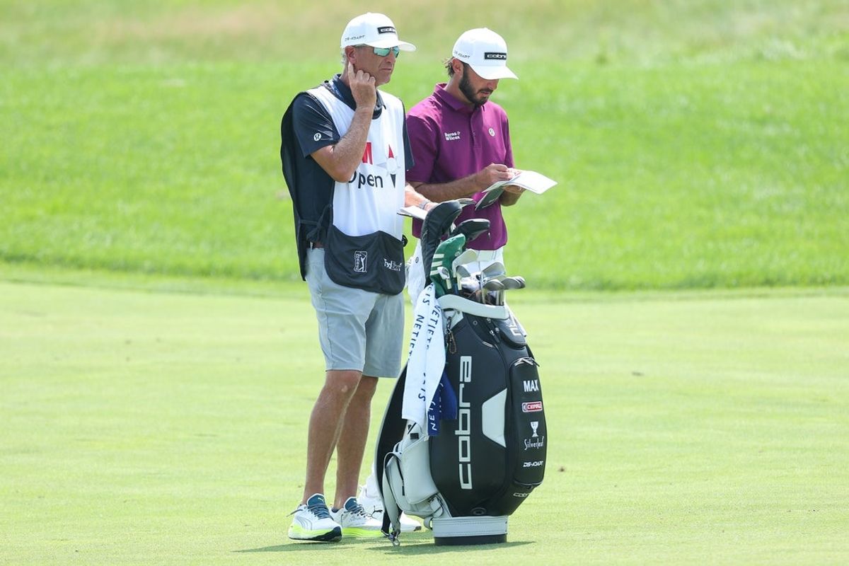 Jul 25, 2025; Blaine, Minnesota, USA; Max Homa and his caddie Lance Bennett look on from the first fairway during the second round of the 3M Open golf tournament. Mandatory Credit: Matt Krohn-Imagn Images