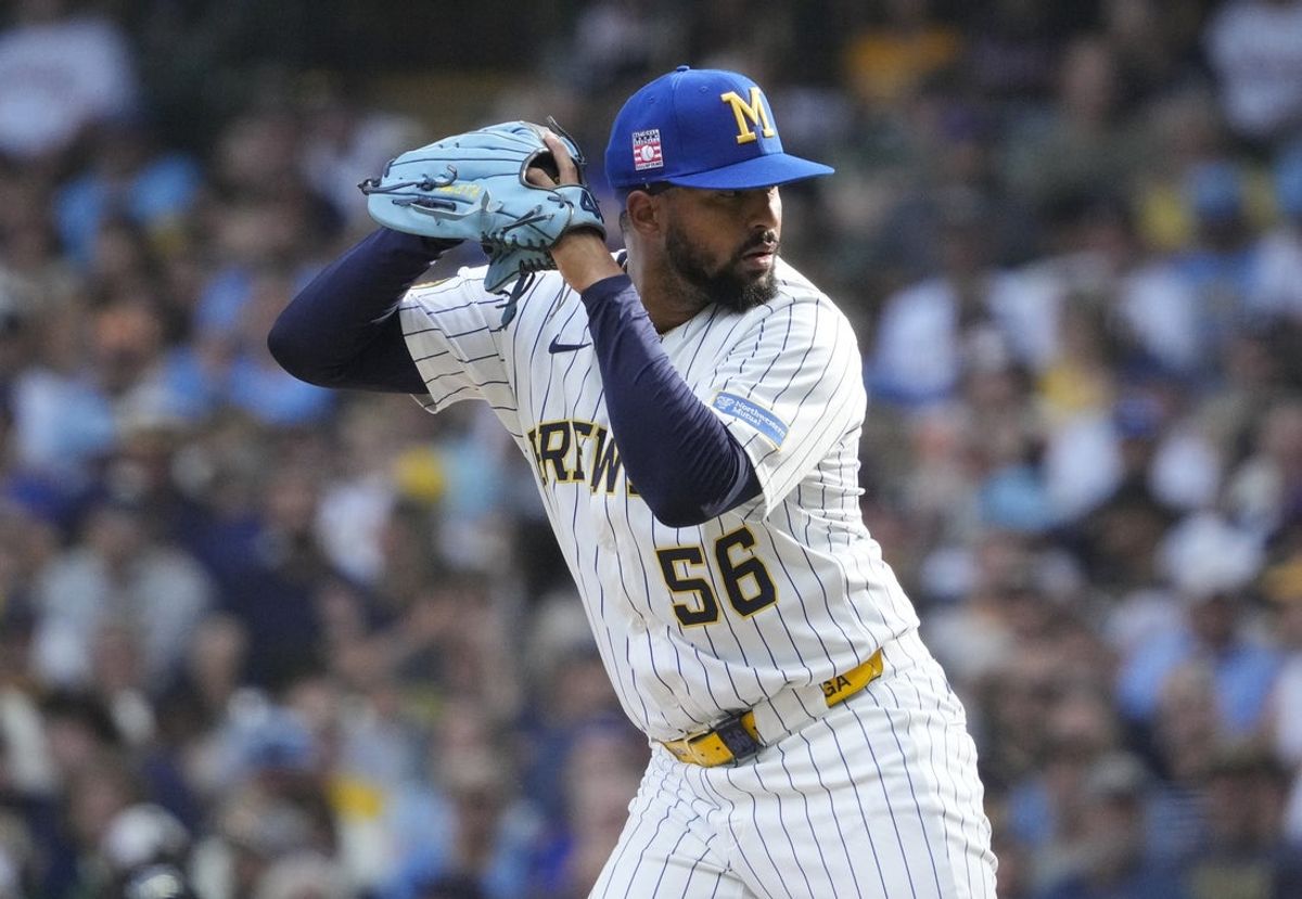 Jul 25, 2025; Milwaukee, Wisconsin, USA; Milwaukee Brewers pitcher Grant Anderson (56) prepares to deliver a pitch against the Miami Marlins in the eighth inning at American Family Field. Mandatory Credit: Michael McLoone-Imagn Images