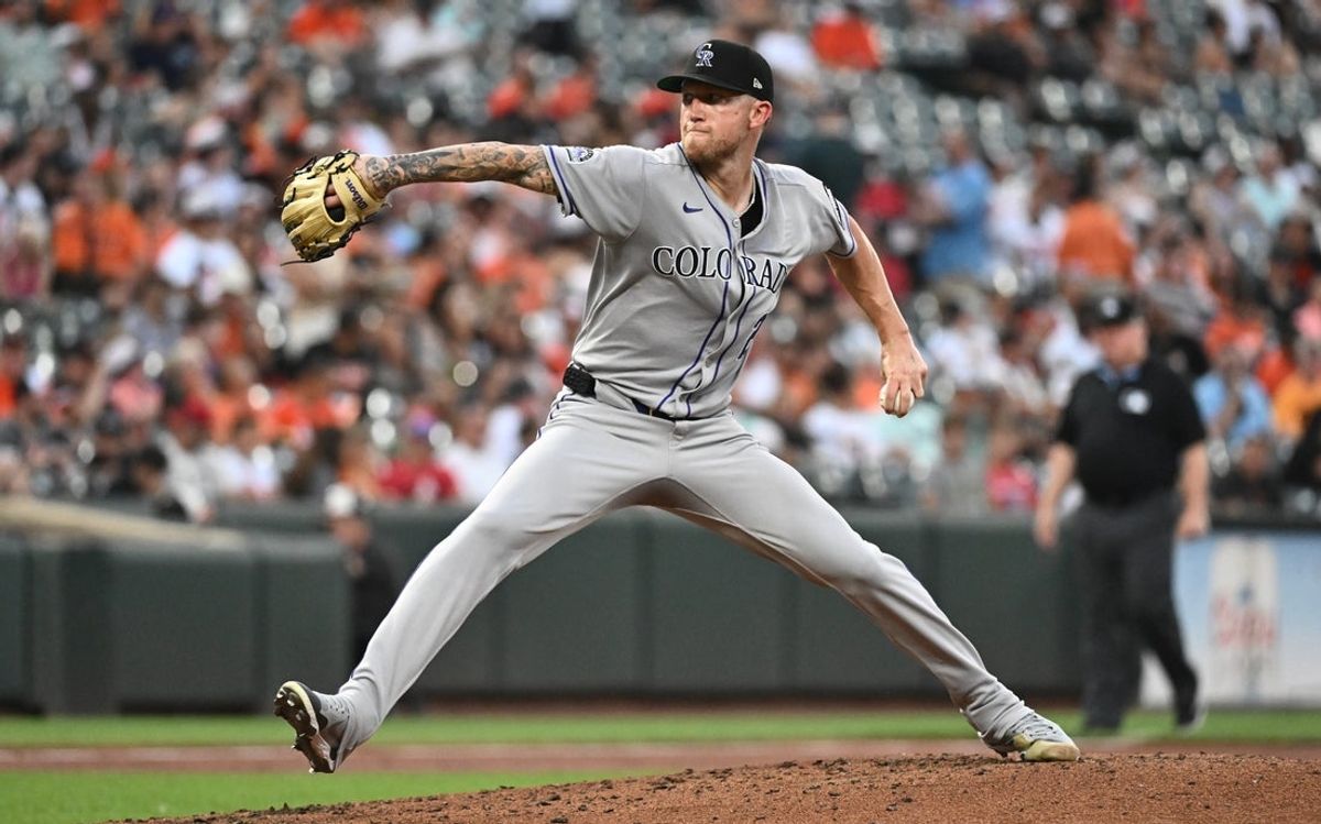 Jul 25, 2025; Baltimore, Maryland, USA;  Colorado Rockies pitcher Kyle Freeland (21) delivers a pitch during the second inning against the Baltimore Orioles at Oriole Park at Camden Yards. Mandatory Credit: James A. Pittman-Imagn Images