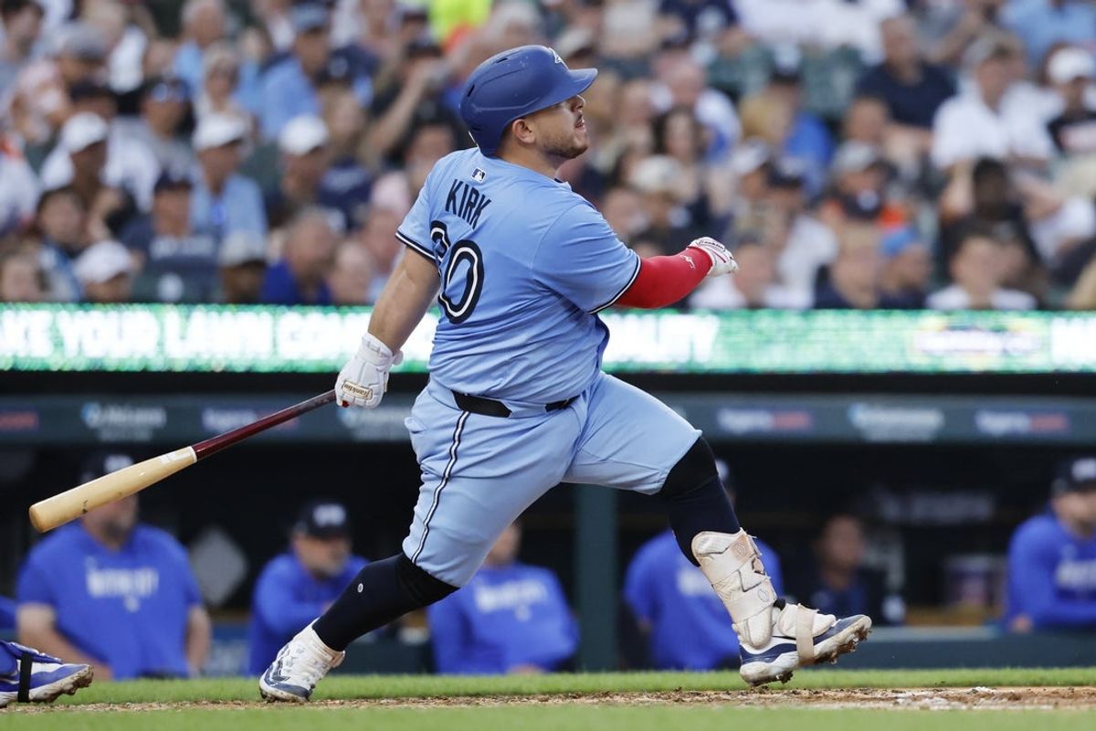 Jul 24, 2025; Detroit, Michigan, USA;  Toronto Blue Jays catcher Alejandro Kirk (30) hits a RBI single in the fifth inning against the Detroit Tigers at Comerica Park. Mandatory Credit: Rick Osentoski-Imagn Images