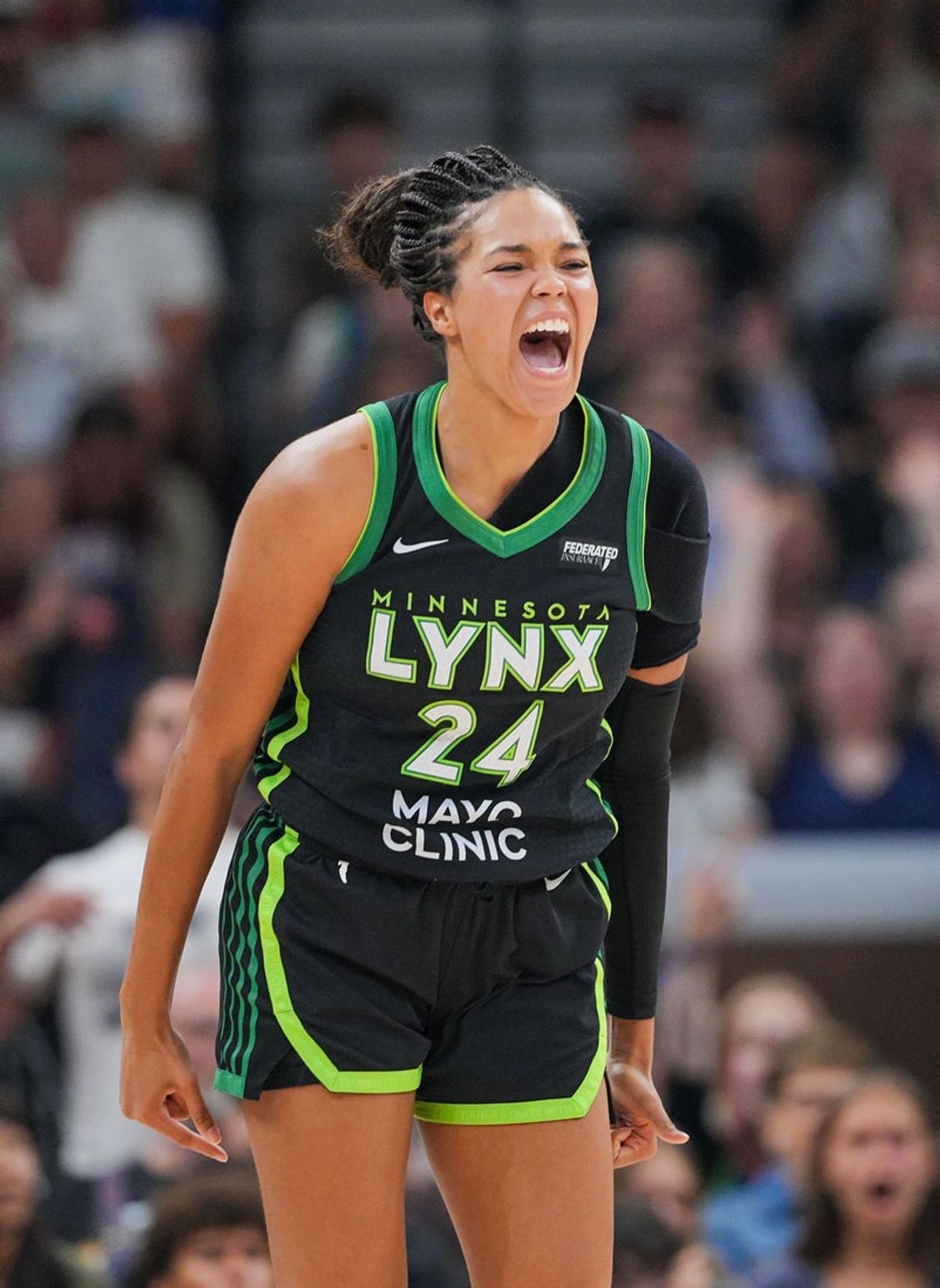 Jul 25, 2025; Minneapolis, Minnesota, USA; Minnesota Lynx forward Napheesa Collier (24) celebrates a basket against the Las Vegas Aces in the second quarter at Target Center. Mandatory Credit: Brad Rempel-Imagn Images
