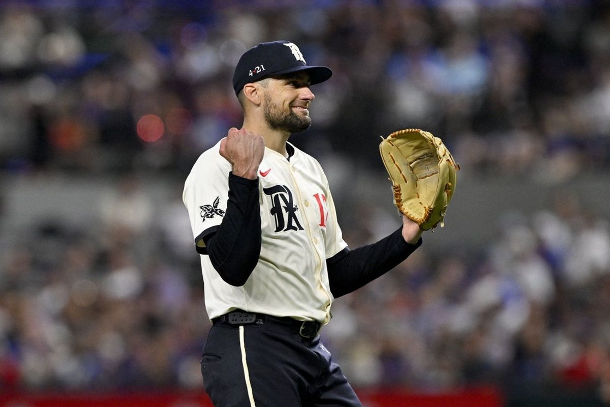 Jul 25, 2025; Arlington, Texas, USA; Texas Rangers starting pitcher Nathan Eovaldi (17) reacts to a call during the fifth inning against the Atlanta Braves at Globe Life Field. Mandatory Credit: Jerome Miron-Imagn Images