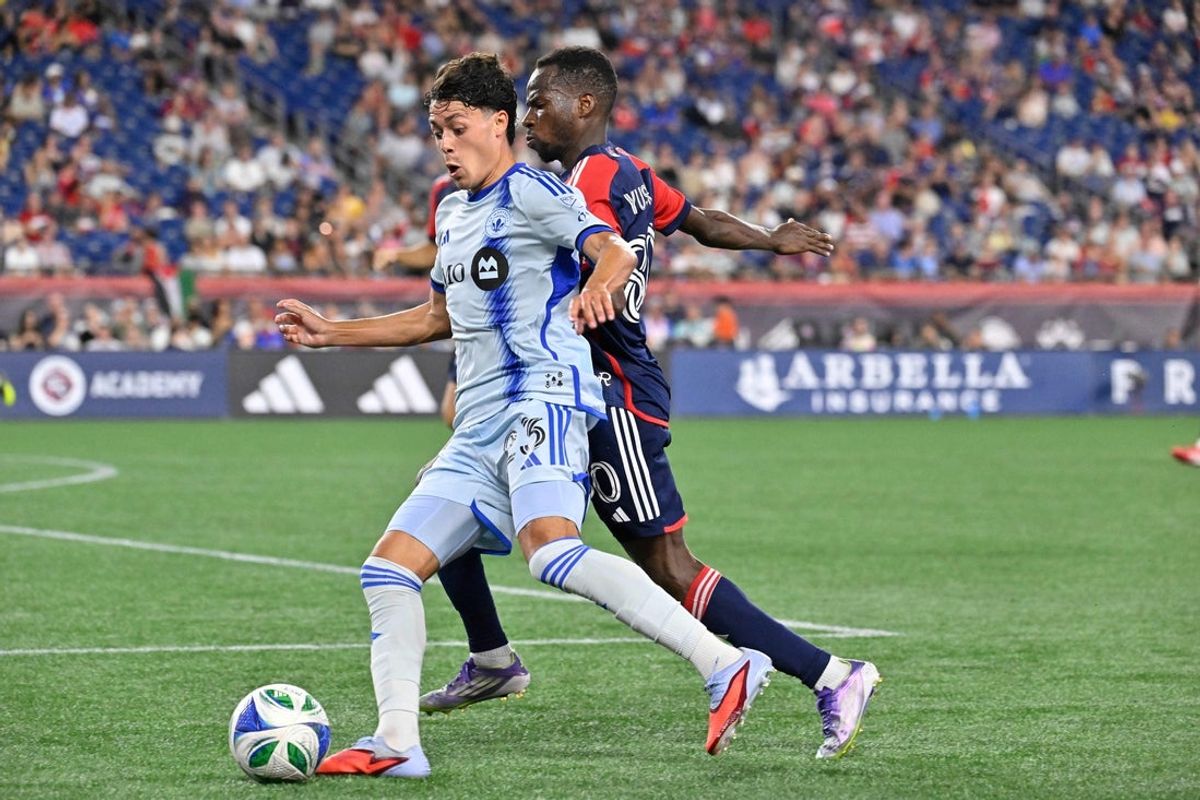 Jul 25, 2025; Foxborough, Massachusetts, USA; CF Montreal midfielder Caden Clark (23) controls the ball against New England Revolution defender Alhassan Yusuf (80) during the second half at Gillette Stadium. Mandatory Credit: Eric Canha-Imagn Images
