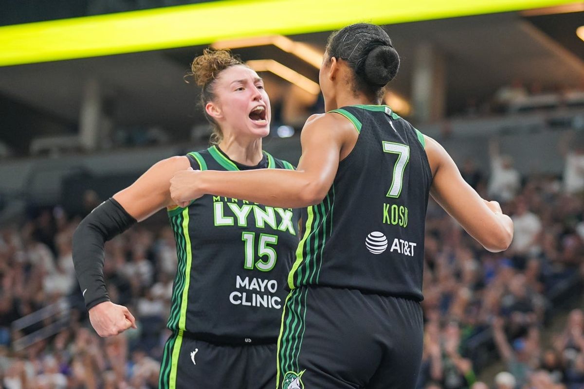 Jul 25, 2025; Minneapolis, Minnesota, USA; Minnesota Lynx forward Jessica Shepard (15) and forward Anastasiia Olairi Kosu (7) celebrate after a basket against the Las Vegas Aces in the fourth quarter at Target Center. Mandatory Credit: Brad Rempel-Imagn Images