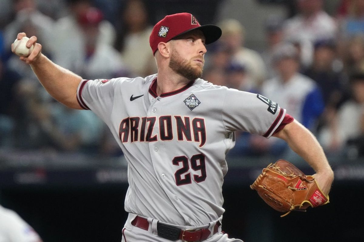 Arizona Diamondbacks starting pitcher Merrill Kelly (29) throws a pitch against the Texas Rangers during the first inning in game two of the 2023 World Series at Globe Life Field on Oct. 28, 2023, Arlington, Texas.