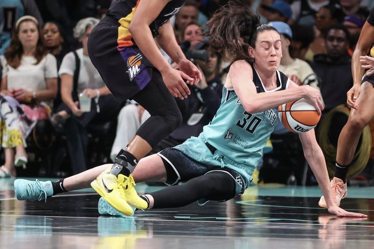 Jul 25, 2025; Brooklyn, New York, USA;  New York Liberty forward Breanna Stewart (30) tries to hold her dribble as she falls to the court in the third quarter against the Phoenix Mercury at Barclays Center. Mandatory Credit: Wendell Cruz-Imagn Images