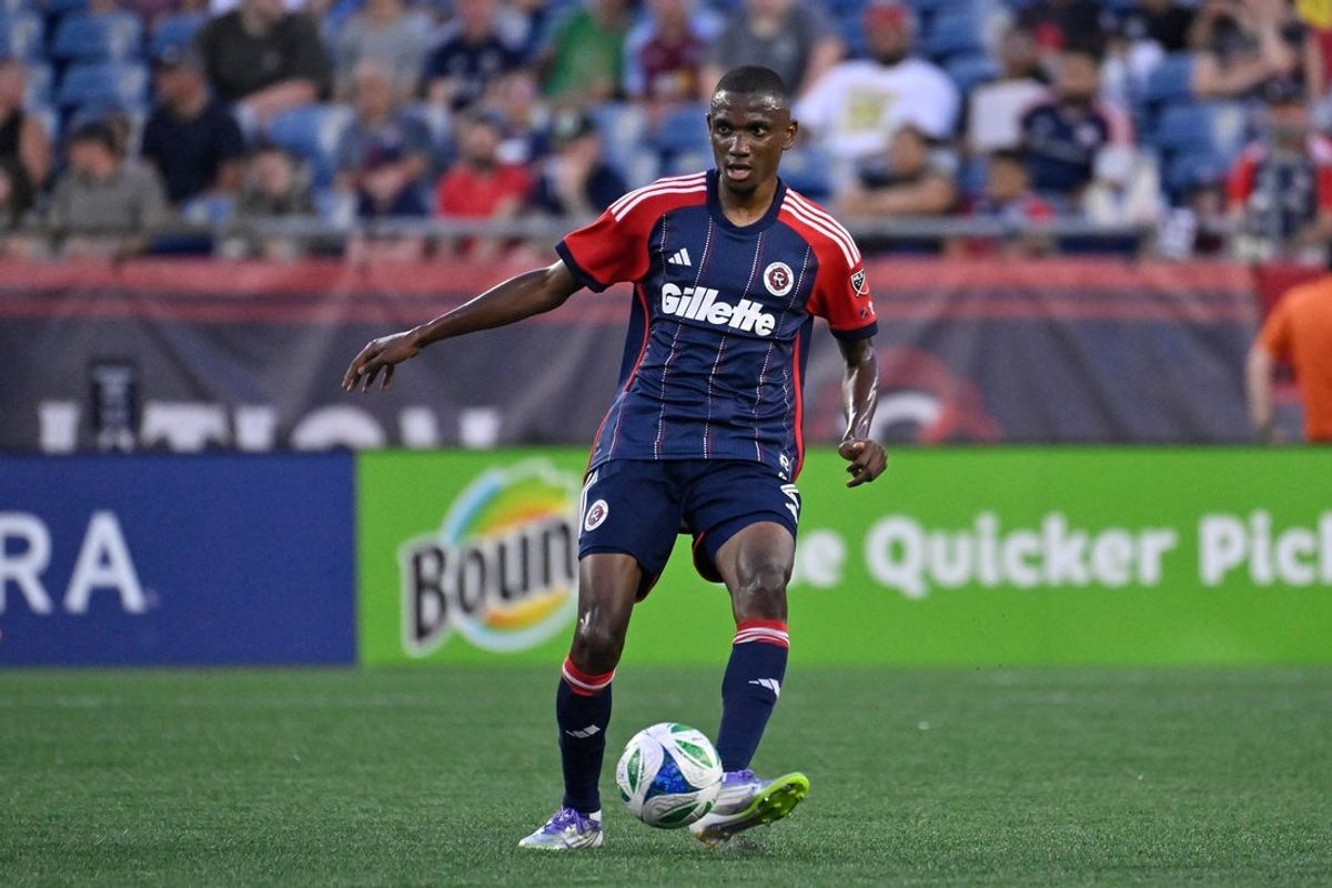 Jul 25, 2025; Foxborough, Massachusetts, USA; New England Revolution defender Mamadou Fofana (2) passes the ball during the first half against the CF Montreal at Gillette Stadium. Mandatory Credit: Eric Canha-Imagn Images