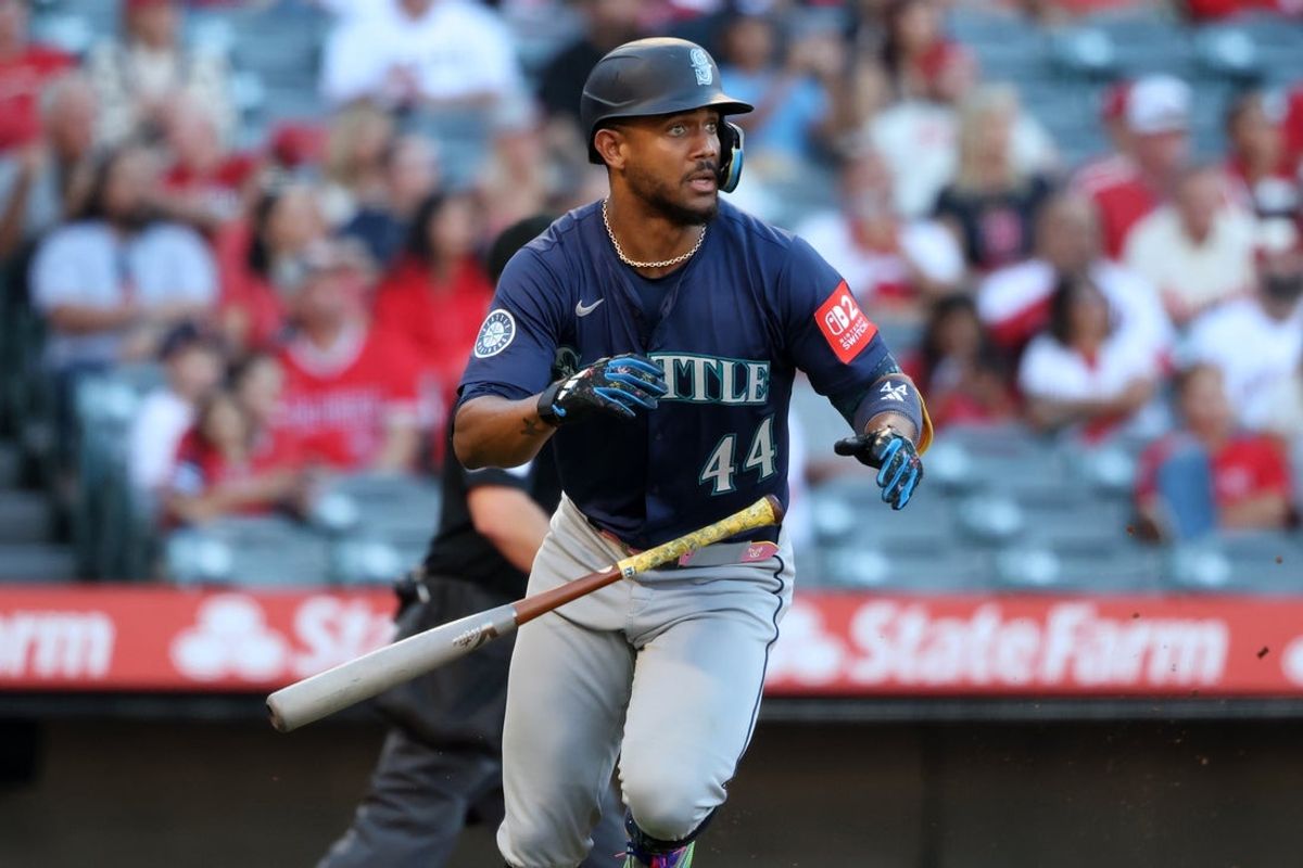 Jul 25, 2025; Anaheim, California, USA;  Seattle Mariners center fielder Julio Rodriguez (44) hits a home run during the first inning against the Los Angeles Angels at Angel Stadium. Mandatory Credit: Kiyoshi Mio-Imagn Images