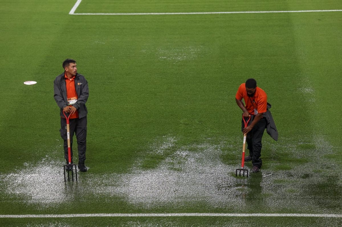 Jul 25, 2025; Houston, Texas, USA;  Grounds crews work on the pitch before the Houston Dynamo FC play against the Los Angeles Galaxy at Shell Energy Stadium. The game was suspended because of severe weather. Mandatory Credit: Thomas Shea-Imagn Images