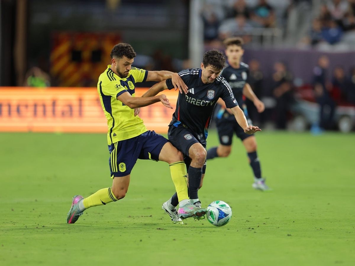 Jul 25, 2025; San Diego, California, USA; San Diego FC denfender Luca Bombino (27) controls the ball against Nashville SC midfielder Patrick Yazbek (8) during the first half at Snapdragon Stadium. Mandatory Credit: Abe Arredondo-Imagn Images
