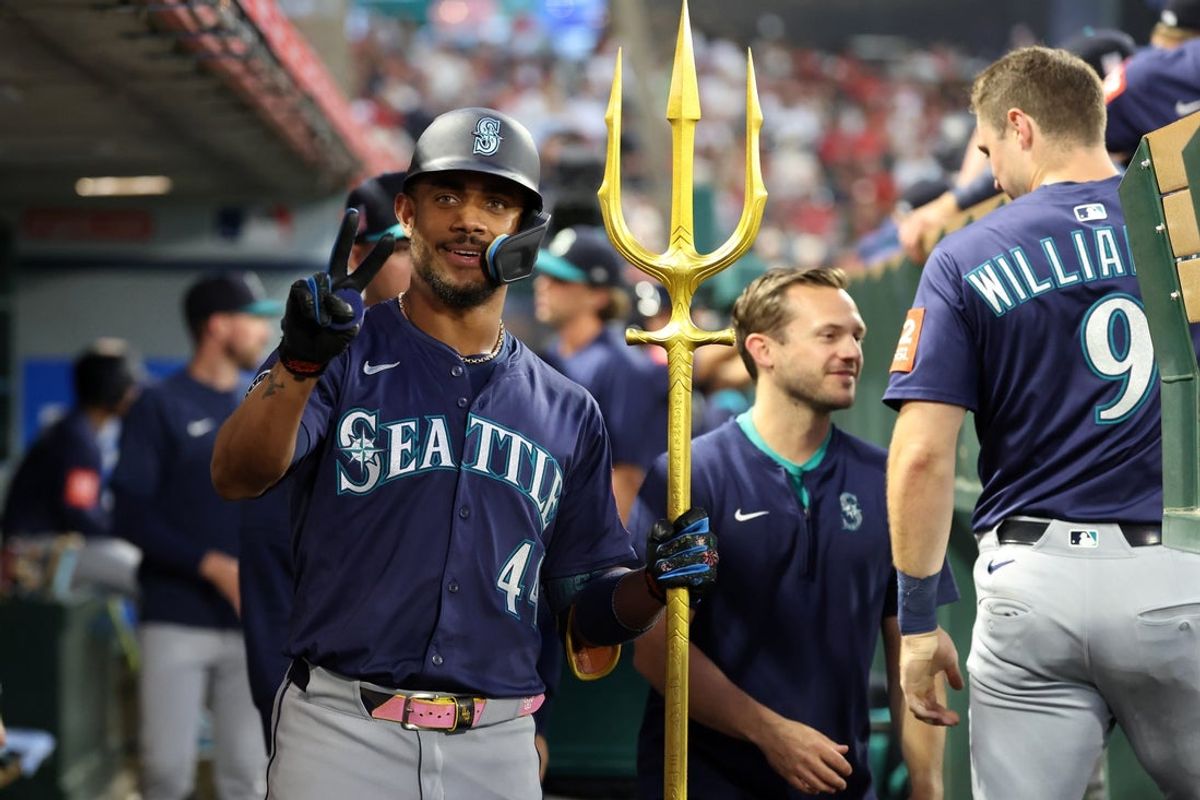 Jul 25, 2025; Anaheim, California, USA;  Seattle Mariners center fielder Julio Rodriguez (44) poses for a photo in the dugout after hitting a home run during the sixth inning against the Los Angeles Angels at Angel Stadium. Mandatory Credit: Kiyoshi Mio-Imagn Images