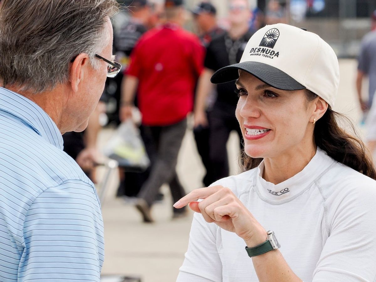 NASCAR Xfinity Series driver Katherine Legge (32) talks Saturday, July 26, 2025, ahead of qualifying for the Pennzoil 250 at Indianapolis Motor Speedway.