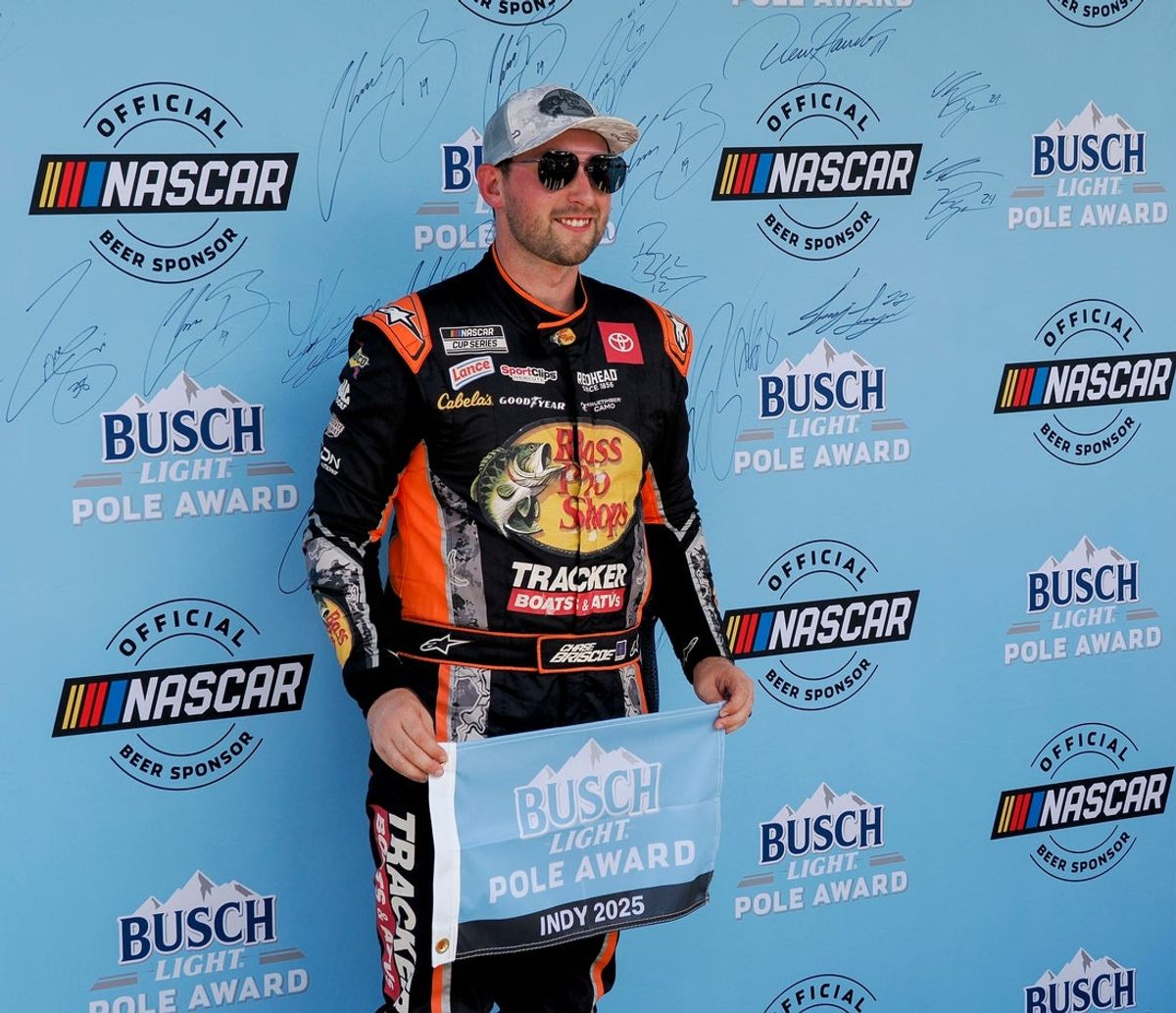 NASCAR Cup Series driver Chase Briscoe (19) poses for photos after winning the pole award Saturday, July 26, 2025, in qualifying for the Brickyard 400 at Indianapolis Motor Speedway.