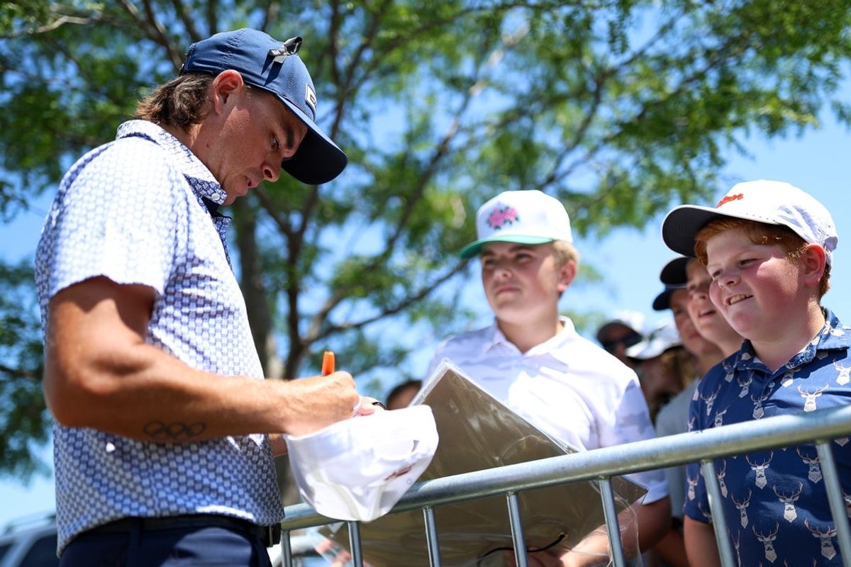 Jul 26, 2025; Blaine, Minnesota, USA; Rickie Fowler signs autographs after his third round of the 3M Open golf tournament. Mandatory Credit: Matt Krohn-Imagn Images