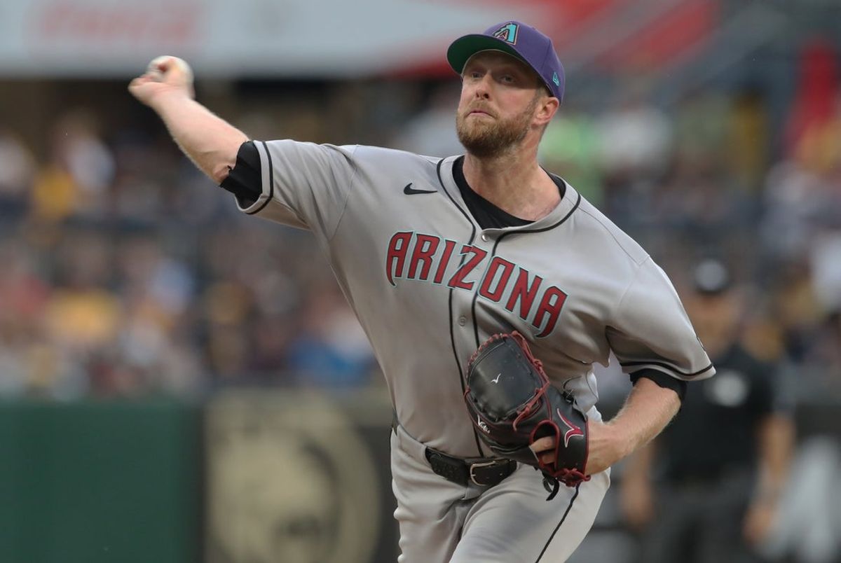 Jul 26, 2025; Pittsburgh, Pennsylvania, USA;  Arizona Diamondbacks starting pitcher Merrill Kelly (29) delivers a pitch against the Pittsburgh Pirates during the first inning at PNC Park. Mandatory Credit: Charles LeClaire-Imagn Images