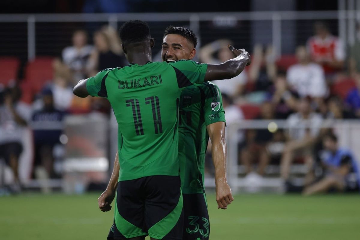 Jul 26, 2025; Washington, District of Columbia, USA; Austin FC midfielder Owen Wolff (33) celebrates with Austin FC forward Osman Bukari (11) after scoring a goal against D.C. United during the first half at Audi Field. Mandatory Credit: Amber Searls-Imagn Images