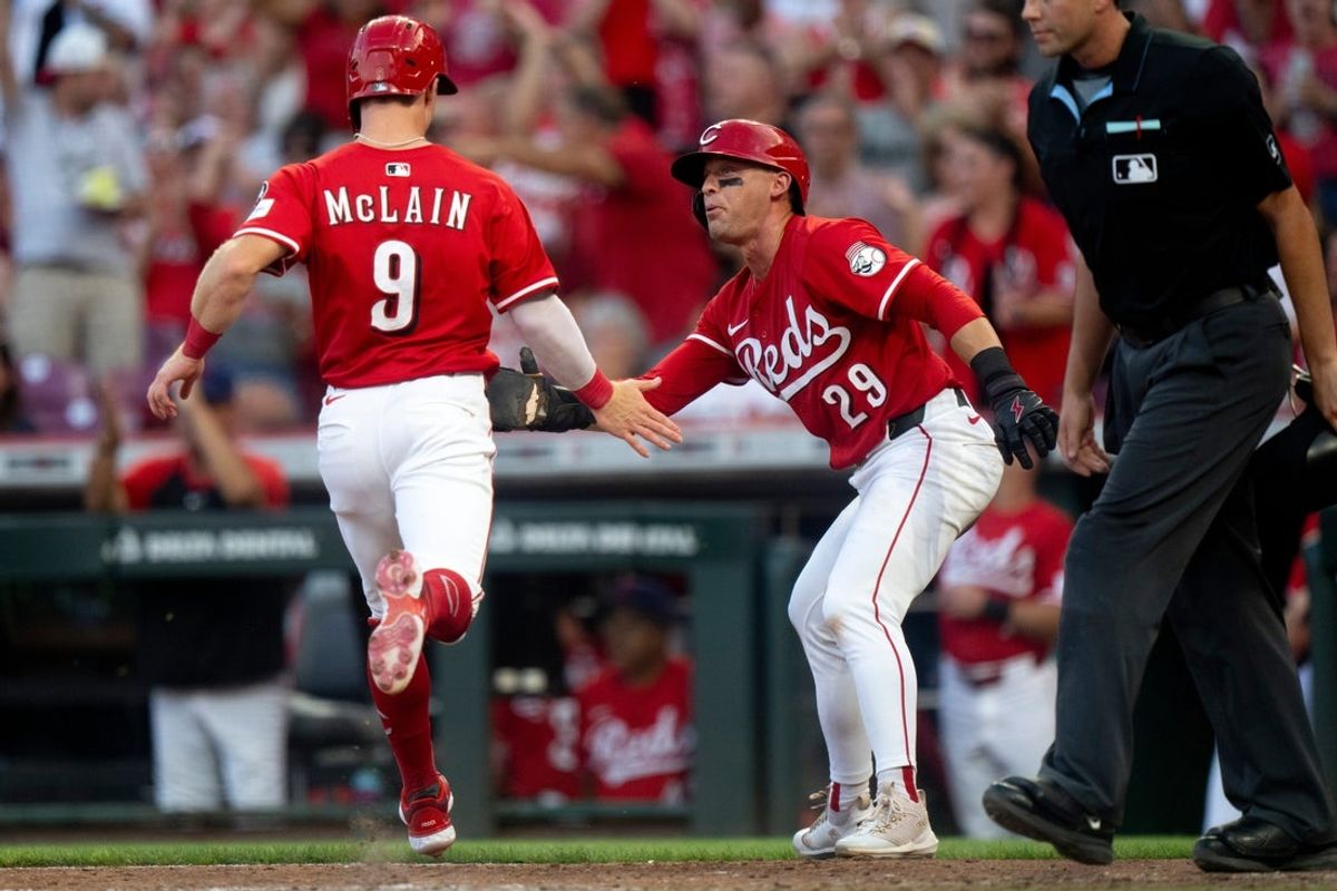 Cincinnati Reds second baseman Matt McLain (9) reacts with Cincinnati Reds center fielder TJ Friedl (29) after they scored on a Cincinnati Reds left fielder Austin Hays (12) base hit in the sixth inning between Cincinnati Reds and Tampa Bay Rays at Great American Ball Park in Cincinnati on July 26, 2025.